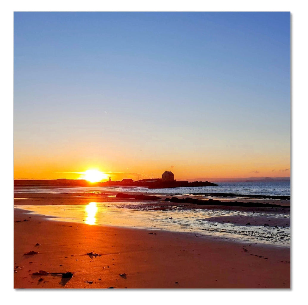 Coastal beach at Ellie, Fife, with early dawn light reflecting on wet sand and shallow water, photographed as part of a four-image panoramic shoreline series.