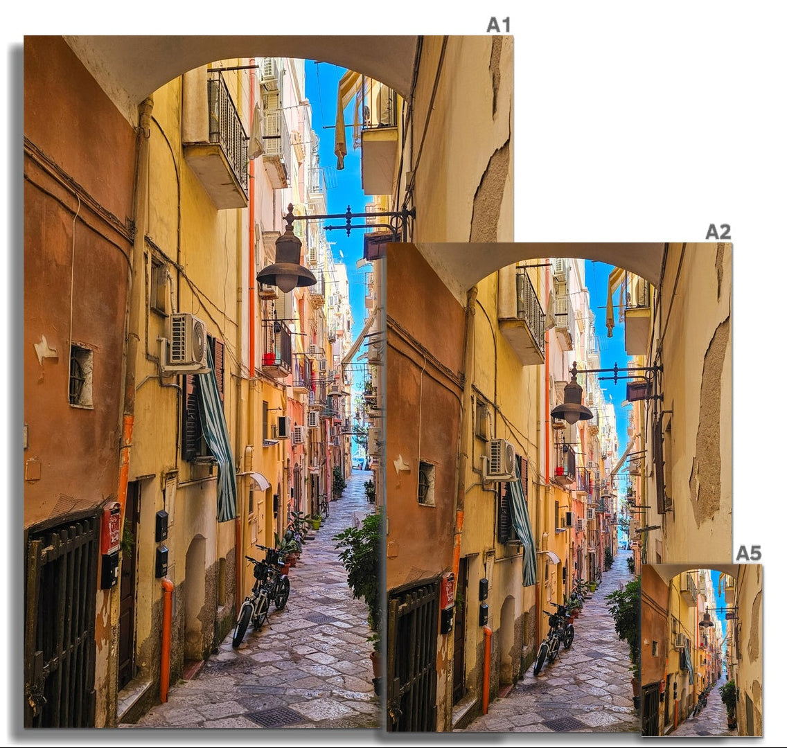 Sotto l’Arco fine art photograph looking through an old archway into a colourful narrow Italian street