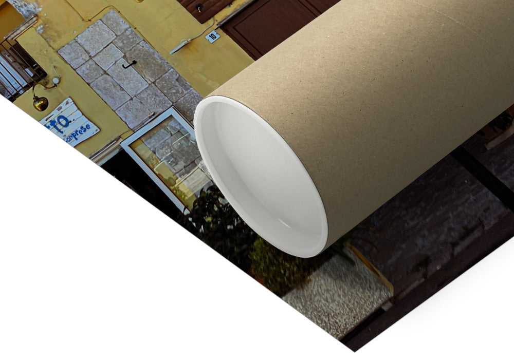 Panni al Sole fine art photograph of a weathered yellow Italian building with balconies and colourful washing in the sunshine