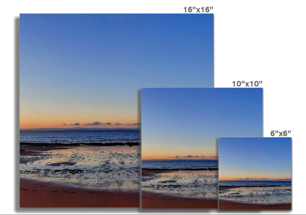 Central shoreline at Ellie to Earlsferry in Fife, showing calm sea, distant horizon and soft dawn light, forming the second panel of a panoramic coastal photograph.